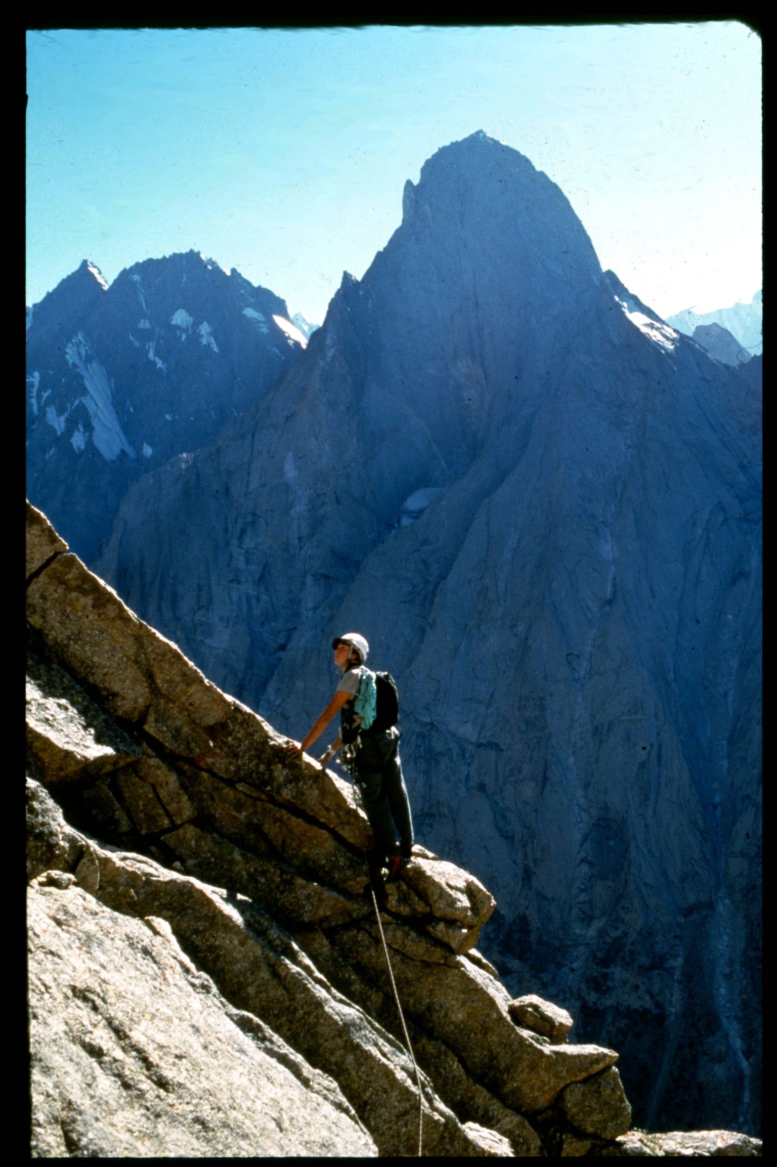 Aksu Valley, Kyrgyzstan 1997. This trip was my first time in Asia, with a solid team of friends. The main attraction was rumor of clean granite, a plethora of peaks, and unusually stable weather. Here, cruising up a ridge after freeing a route called Big Yellow Moon on Peak 3850.